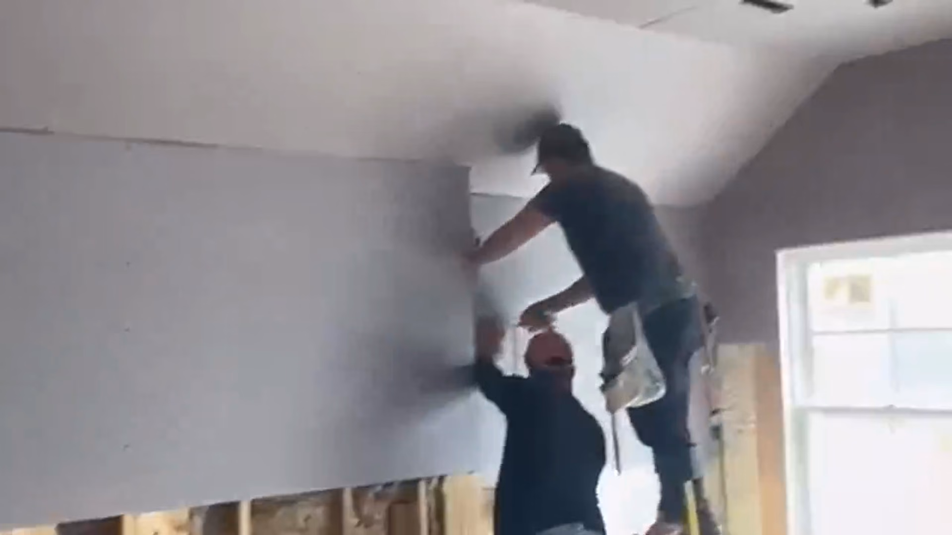L&A Plastering crew installing drywall on a job site in Greater Boston