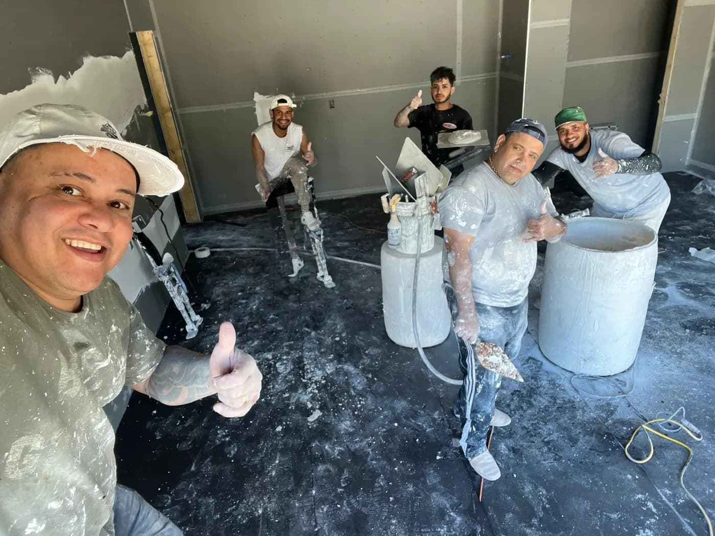 A professional plastering and drywall crew on the job